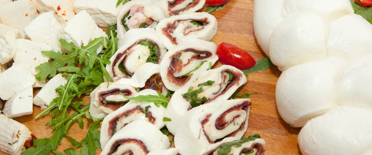 Roll with tomato mozzarella cheese raw ham.