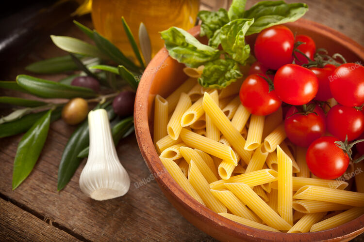 Ingredients of Pasta alla Norma on wooden table