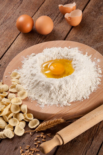 Italian pasta orecchiette homemade on wooden table