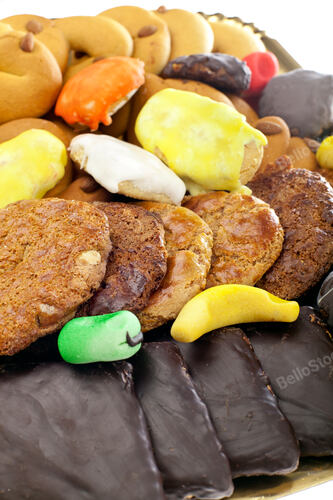 Mix of pastries and cookies in the tray.