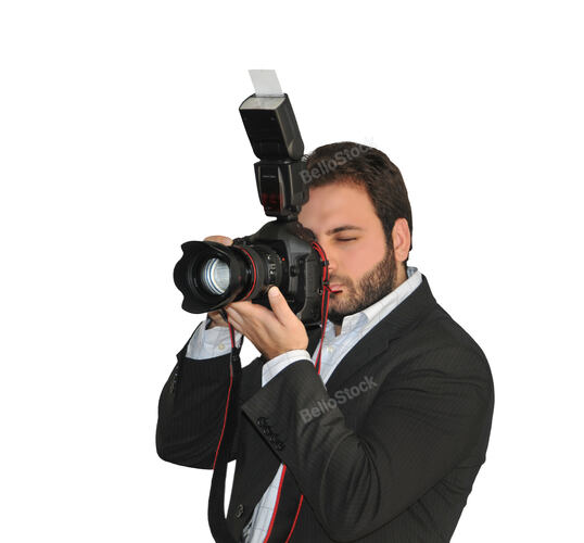 Young photographer takes pictures with the camera and flash 