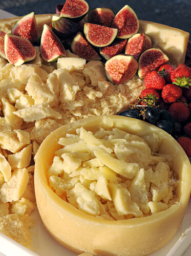 Parmigiano Reggiano wheel hollowed as bowl filled with chees