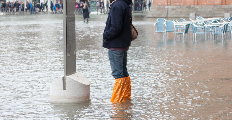 Close Up of legs with boots due to the high water. This floo