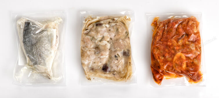 Three different fresh vacuum packed healthy meals in plastic