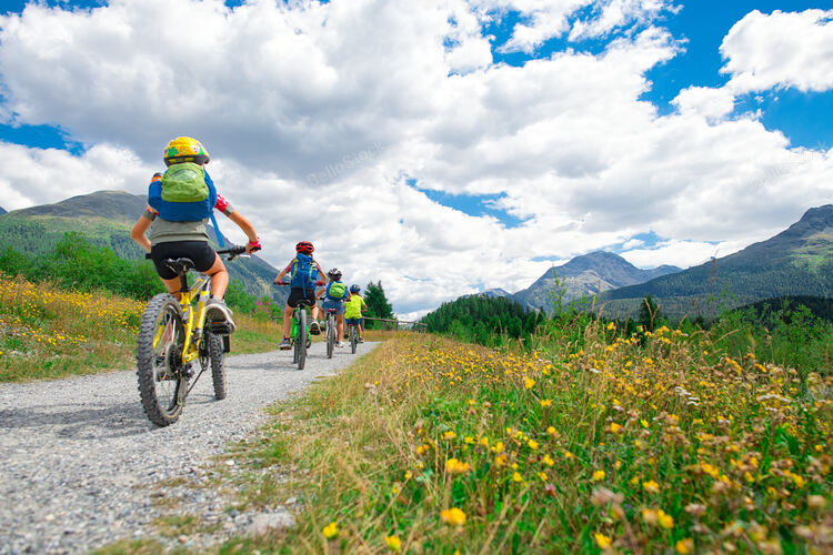 Group of children during a bike ride in the mountains.