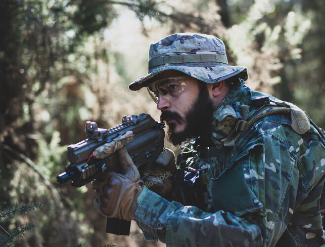 Airsoft military game player in camouflage uniform with arme