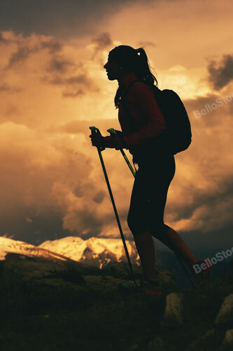 Walk in a religious pilgrimage in the mountains. A young wom