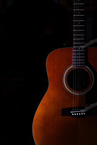 Acoustic guitar on a black background