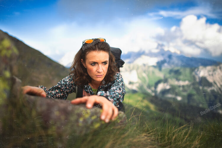 Beautiful sporty girl in a mountain pass. Vintage style phot