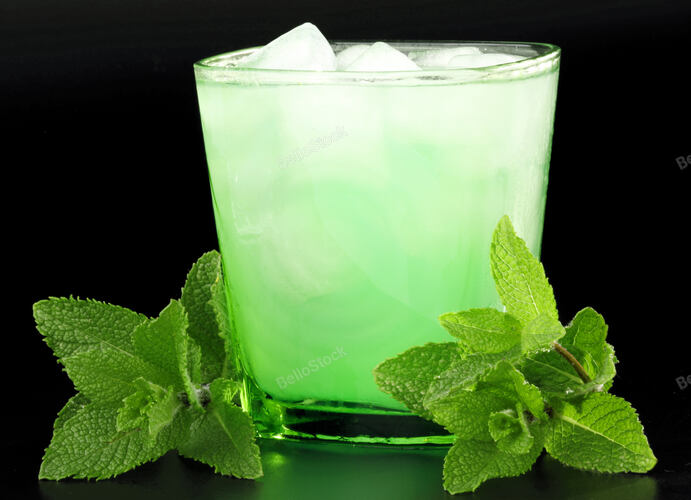 Drink with mint and ice on black background