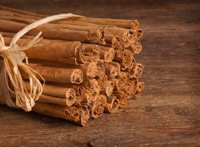 Bunch of Ceylon cinnamon on wooden table