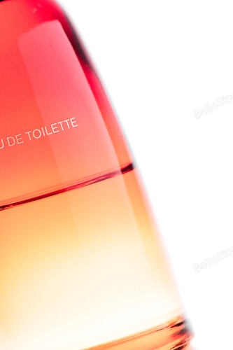 Detail of perfume bottle on white background