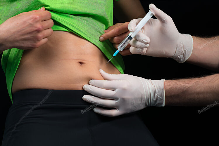 Doctor who makes the sting in the belly to a patient on a bl